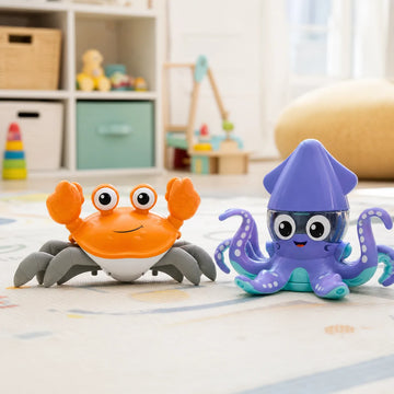 Crawling crab toy and dancing squid toy side by side on a playroom floor