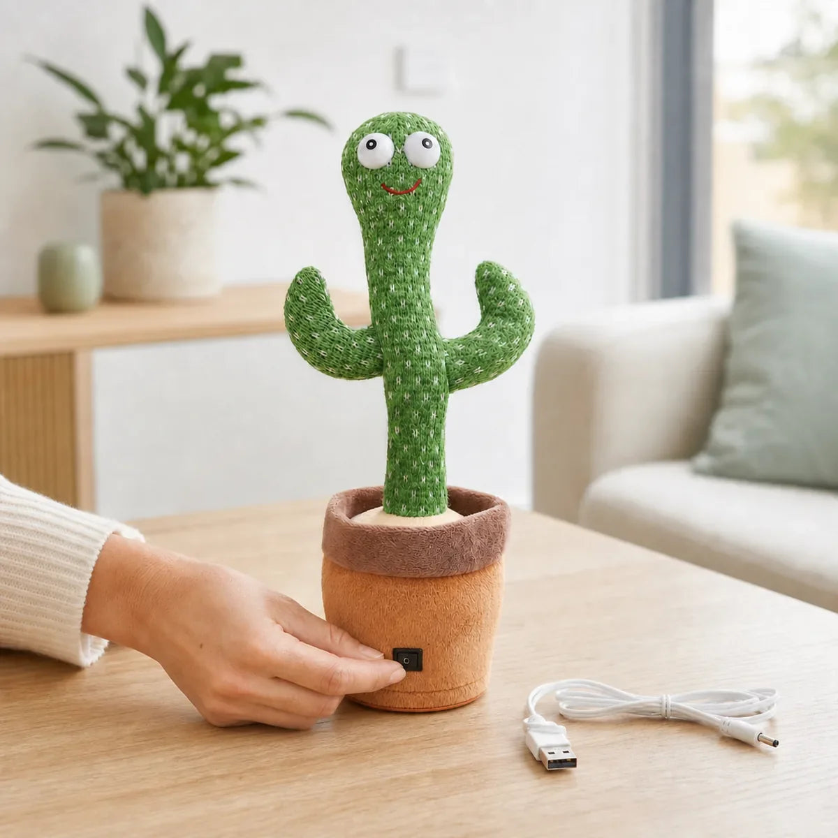 Parent checking the power switch on a dancing cactus toy